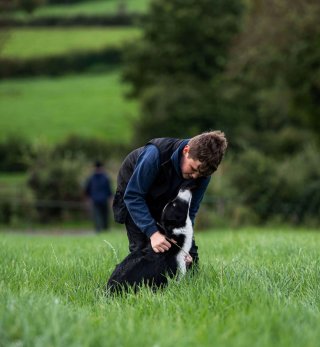 A boy and his dog on the farm of one of our milk suppliers.