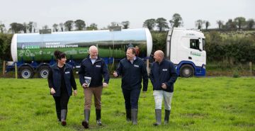 Some of the Lakeland Dairies team in front of a milk tanker.