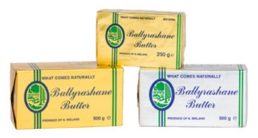 3 blocks of Ballyrashane butter in gold and silver wrappers