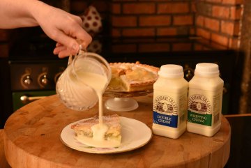 Ballyrashane cream products being poured onto a slide of apple tart