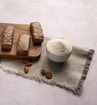 Protein bars on wooden board with acid casein