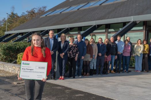 One of the Lakeland Dairies bursary winners stood in front of a group outside Lakeland Dairies HQ in Killygarry.