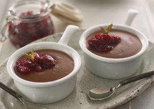 Two pots of blackberry chocolate pots made with Lakeland Dairies products