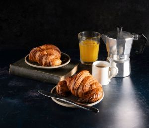 Breakfast croissant coffee and orange juice