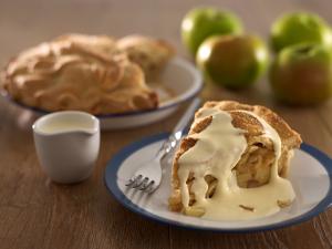 Springcool cream drizzled on a slice of apple pie.