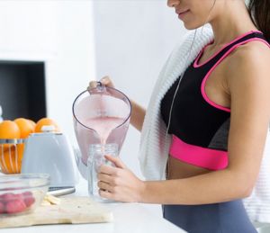 Girl making a smoothie