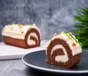 A slice of Irish coffee roll cheesecake made with Lakeland Dairies products, placed on a plate