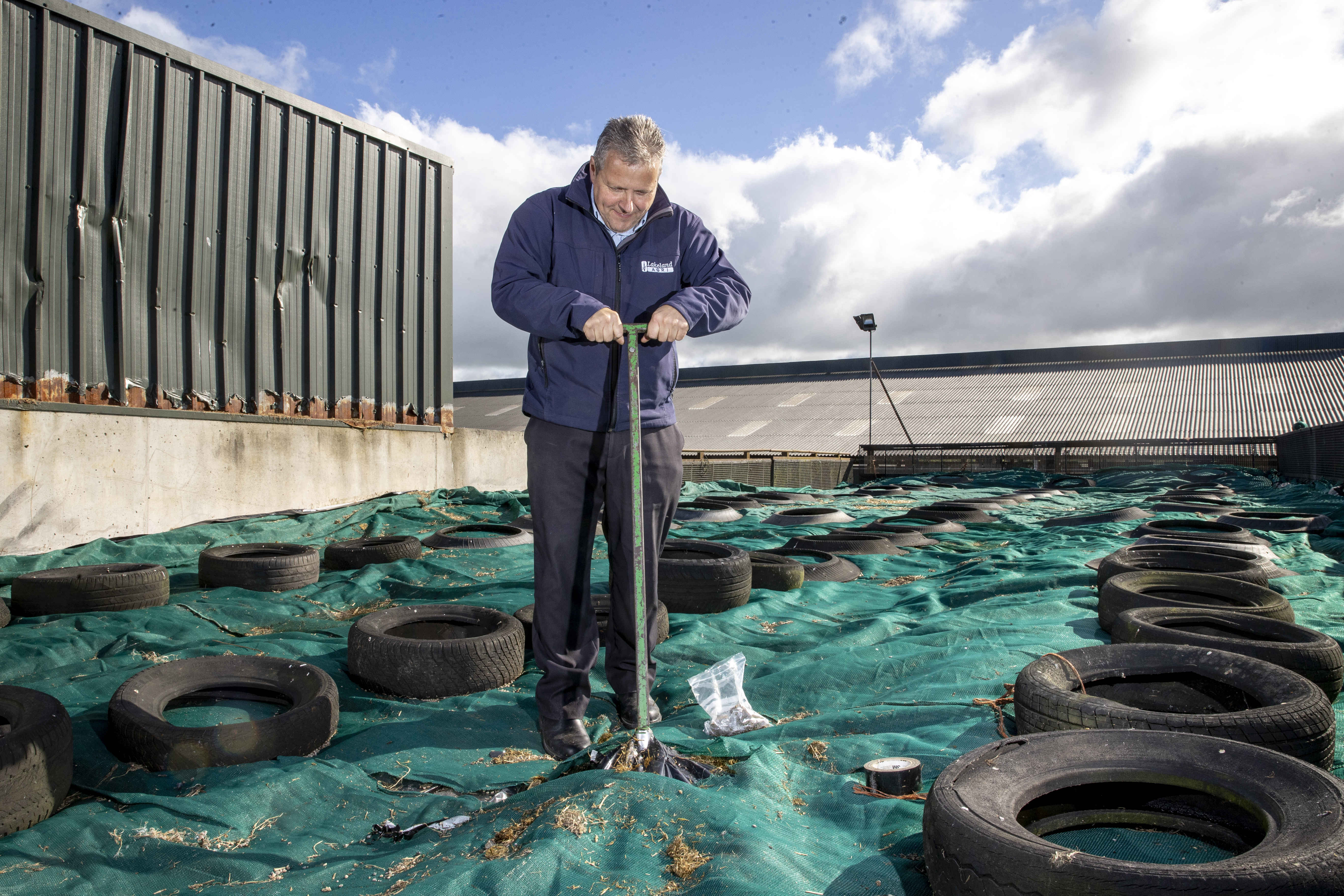 A Lakeland Dairies team member working on a silage pit.