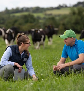 Alan Clarke and Joint Programme worker, Susan Casey working in a field.