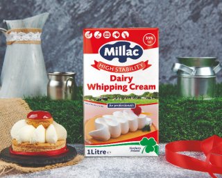 Pack of Millac High Stability Dairy Whipping Cream 1L next to a cream pastry dessert