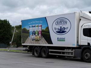 Picture of Champion delivery truck with Champion product range on the side