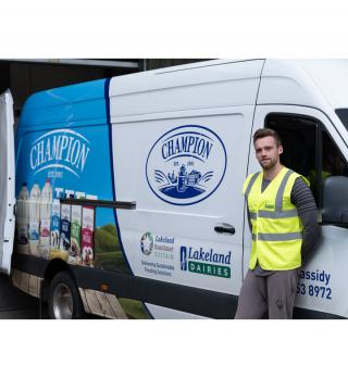 Side of milk man at Champion delivery van