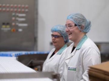 Two members of the Lakeland Dairies team working on site.