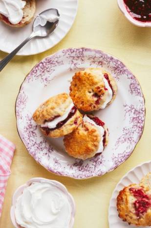 Mini scones with cream and raspberry jam, made with Lakeland Dairies butter