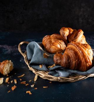 Basket of flaky croissants