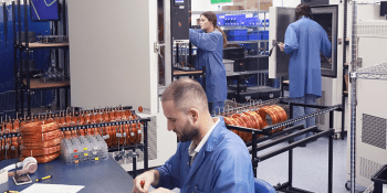 ACI employees working with new equipment