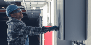 Electrician looking at a wall