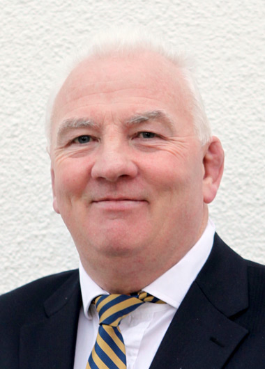 Man wearing a suit and tie with a white background
