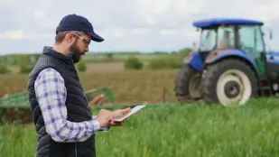 A farmer using new technology to optimise his farming.